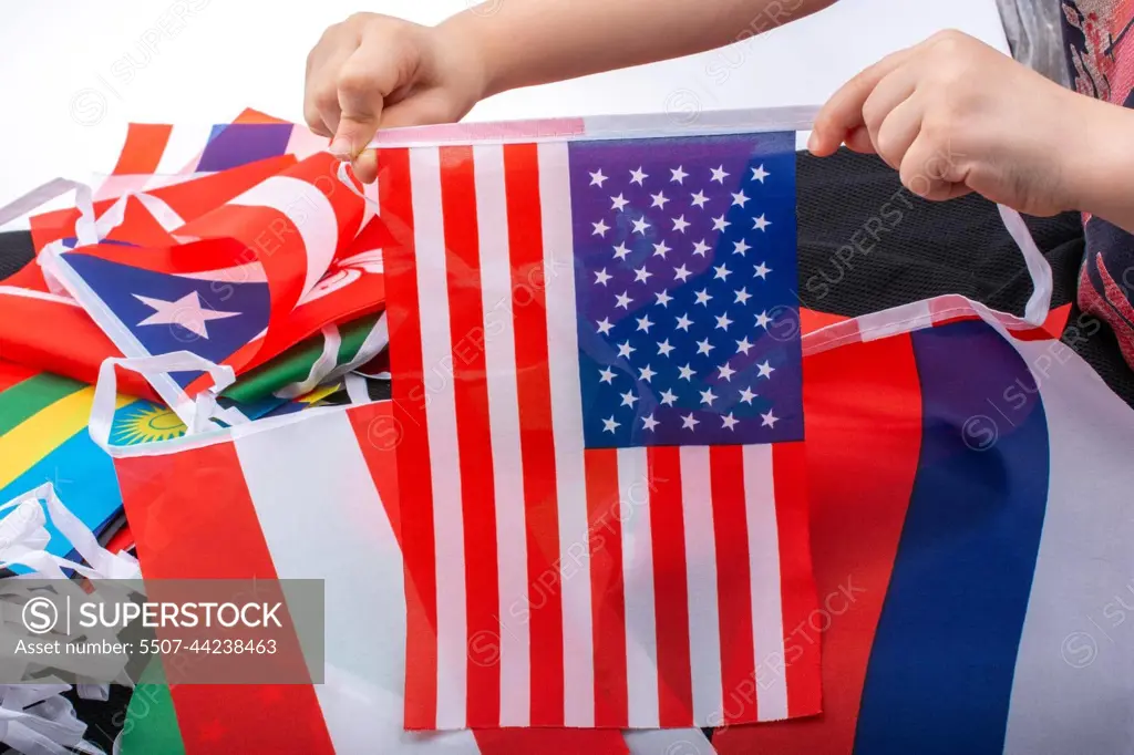 Child hand holding an American flag in hand