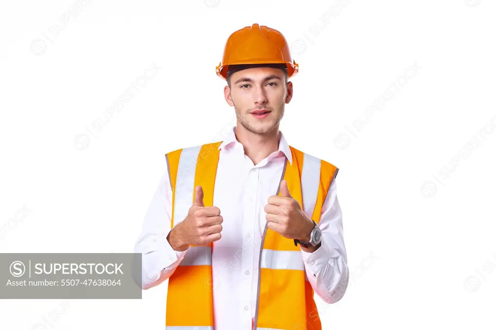 working man in orange uniform posing construction - SuperStock