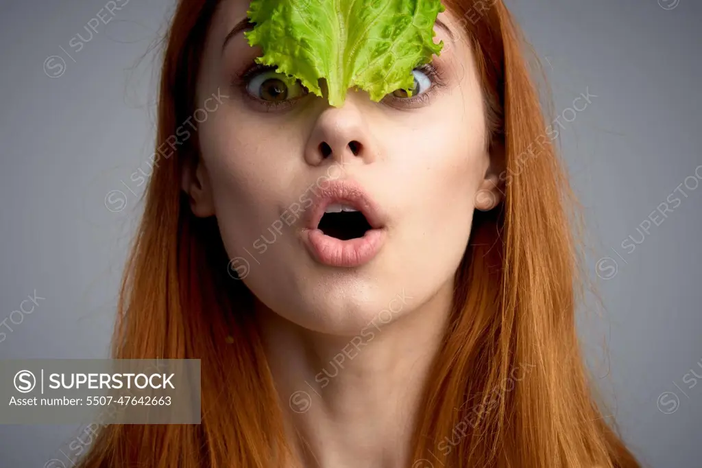 woman with lettuce leaf healthy food diet lifestyle