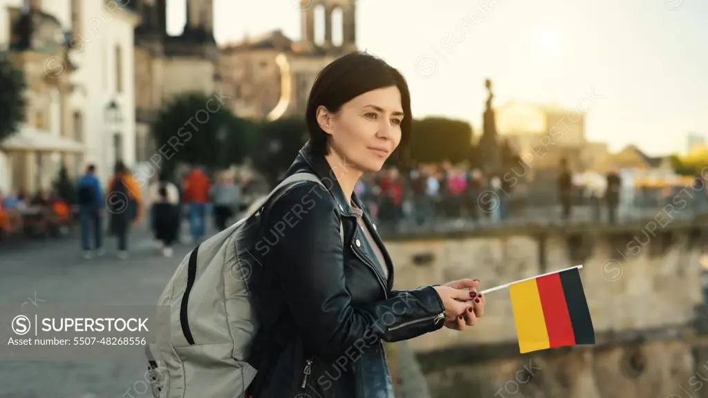 Young Woman Holds German Flag In Hand