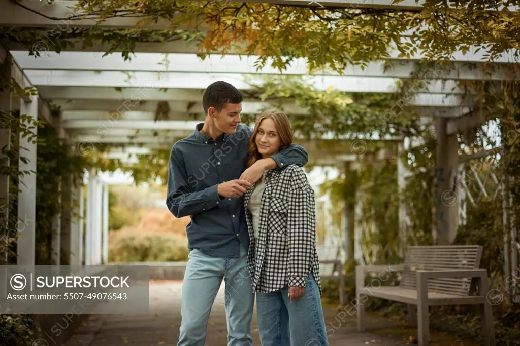 Warm Embrace of Teen Love in the Autumn Park. Capturing Teen Moments: Love Blossoms in Autumn's Embrace. Teenagers in Love: Embracing the Autumn Vibe