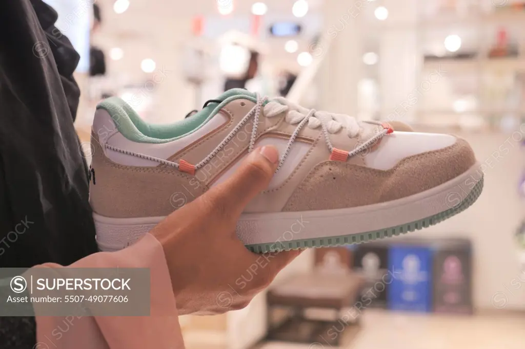 women choosing shoes at local store