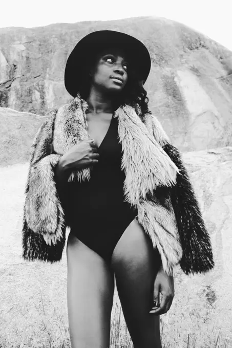 Rocking it old school. Monotone shot of an attractive young woman posing on the beach.