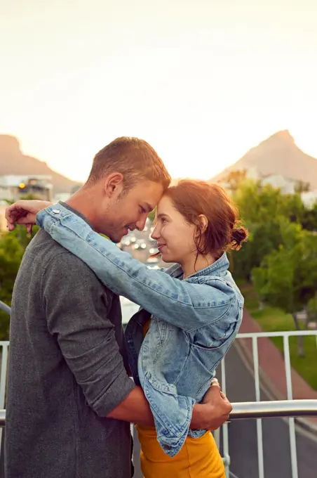 I love falling in love with you. Shot of a happy young couple enjoying a romantic moment in the city.