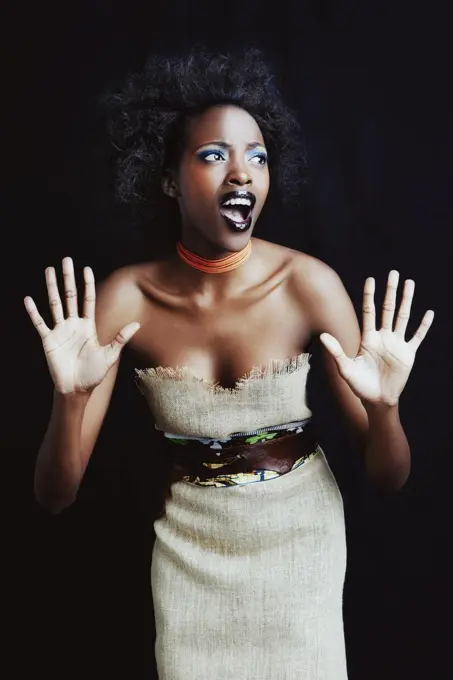 Shes an african queen. A beautiufl young african woman posing in the studio isolated on white.