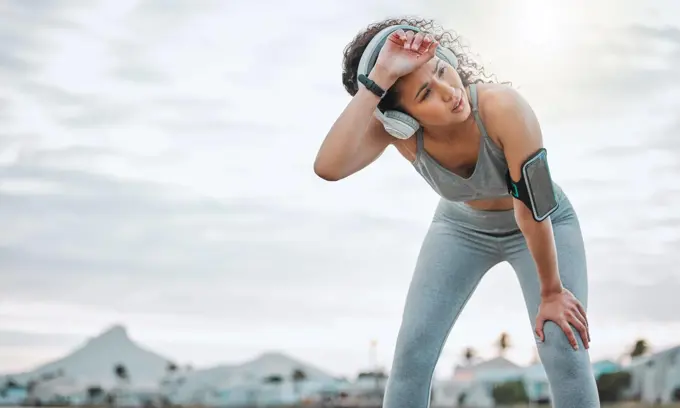 What a way to work up a sweat. Cropped shot of an attractive young female athlete exercising outdoors.