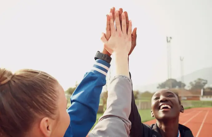 Therell never be another like us. a group of athletes high fiving one another.