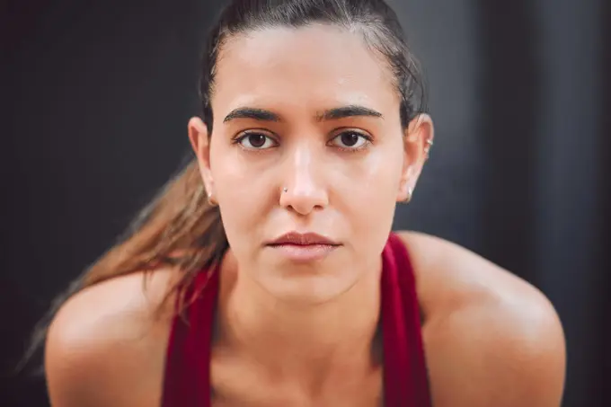 Focused on the run. Cropped portrait of an attractive young female athlete looking tired while running outdoors.