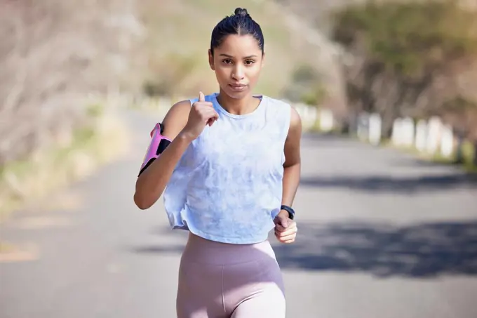 Each stride has purpose. Cropped portrait of an attractive young female athlete enjoying a run outdoors.