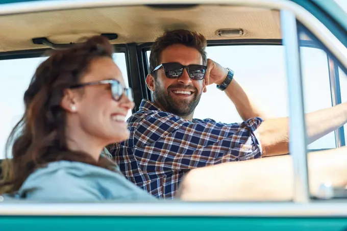 Theres nothing better than a roadtrip with her. an affectionate couple enjoying a summer roadtrip.