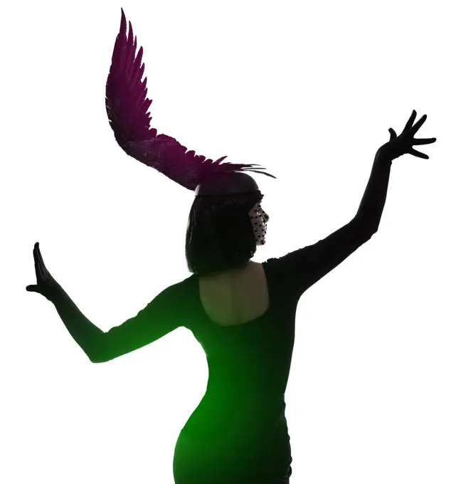 Spreading her fashion wings. Rear view shot of a young woman wearing a wing-shaped headpiece.