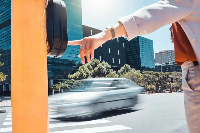 Woman hand pressing a traffic light button at a pedestrian crossing on the urban city street. Outdoor crosswalk, road and business employee walking, commuting or traveling to work in the town.