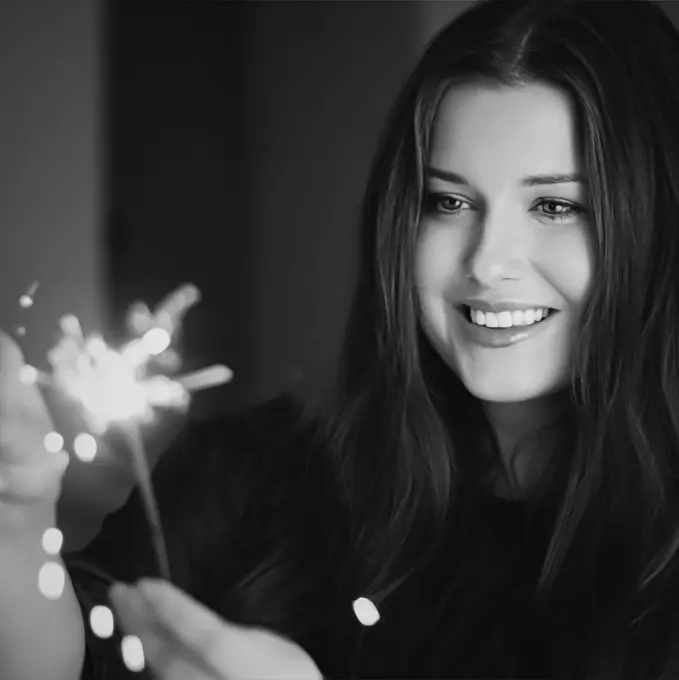 Holiday magic, Christmas and New Year celebration, happy woman with sparklers