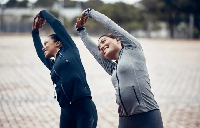 Fitness, friends and stretching with women in city for sports training, workout and health together. Exercise, wellness and running with girl athletes in outdoor for teamwork, goals and performance