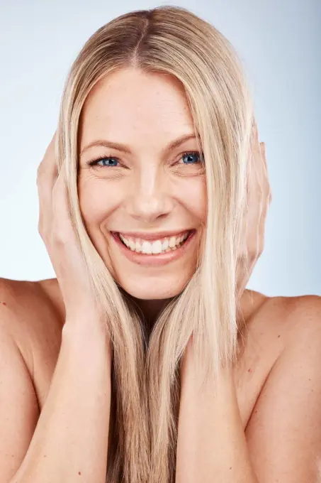 Hair, woman and portrait of a beauty woman for healthy haircare on a grey studio background. Hair care, wellness and hair care for a female with a hairstyle looking happy with her healthy hair