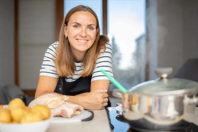 Young woman is cooking in the kitchen. Healthy eating. Healthy lifestyle.