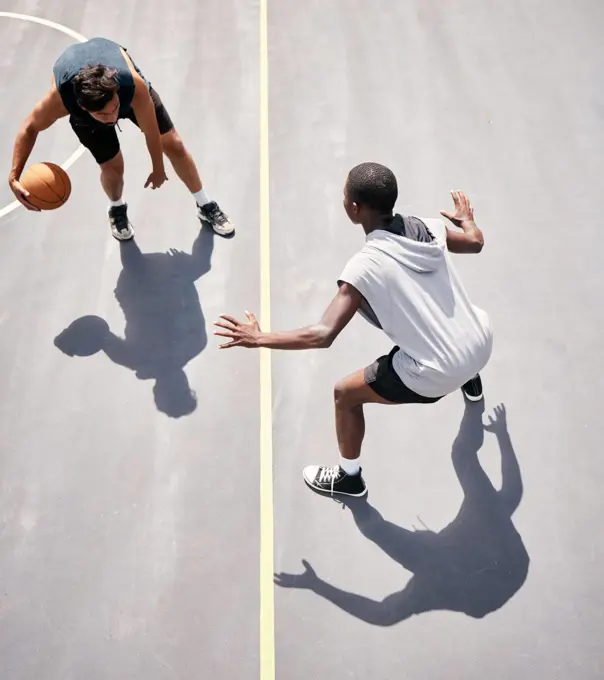 Basketball and basketball player on the court from above for a game during summer for fitness and sport. Sports, active and youth playing competitive match for cardio, stamina and tournament