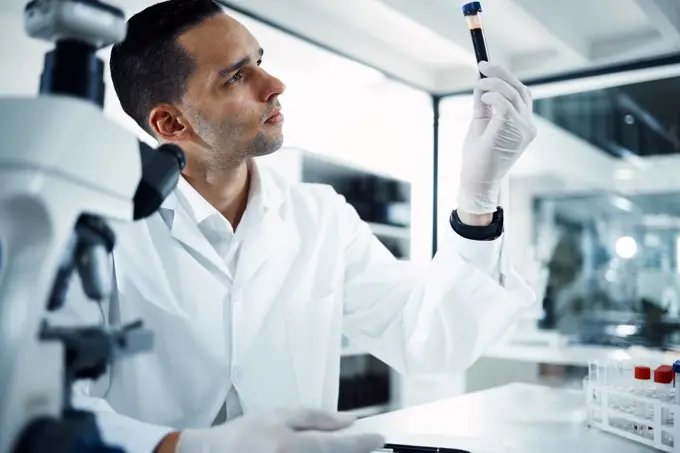 Man, scientist and analysis of blood sample in test tube, DNA and science experiment in laboratory. Male doctor with gloves, study liquid with forensics, scientific innovation and medical research