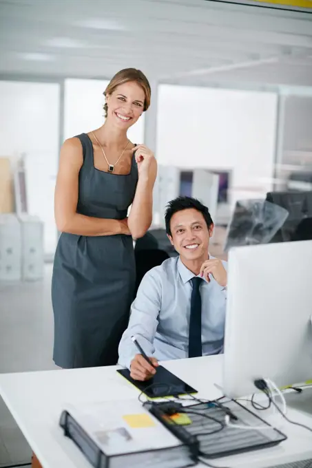 Were ready to take on any challenge. two colleagues working together on a computer.