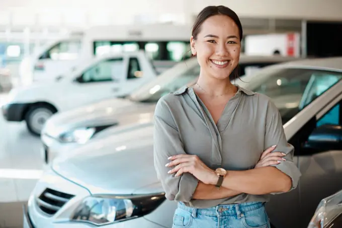 Ive found the one. a young woman standing next to the car shes about to buy.