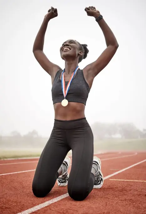 Ive never wanted anything more. a young female athlete celebrating her run.