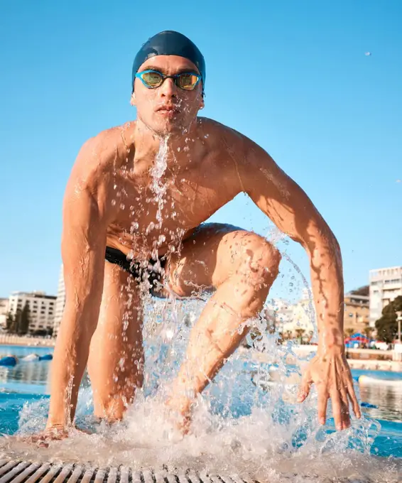 Daily goal crushed. a handsome young male athlete swimming in an olympic-sized pool.