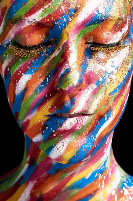 Beauty is art. Cropped shot of a young woman posing with paint on her face.