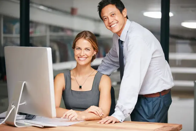 They know what their goals and priorities are. two colleagues working together on a computer.