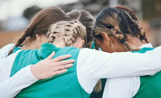 Hug, sports women or team in huddle with support, solidarity or plan for a hockey training game. Group, strategy or female athletes in practice for fitness exercise or match together for teamwork