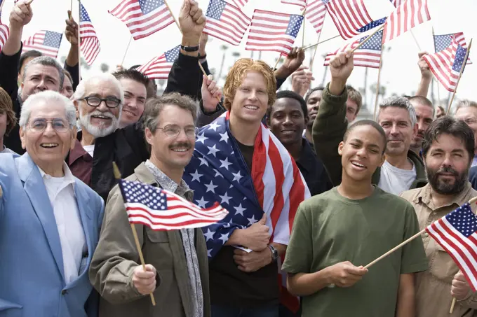 Crowd holding American flags