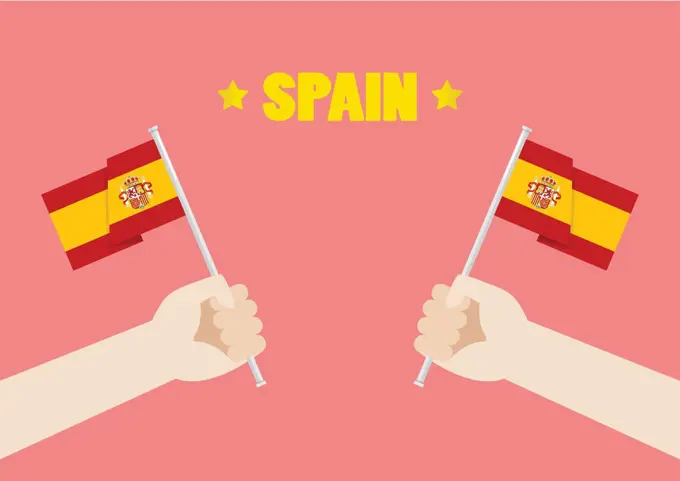 Spain National Day with Hands Holding Up Spain Flags