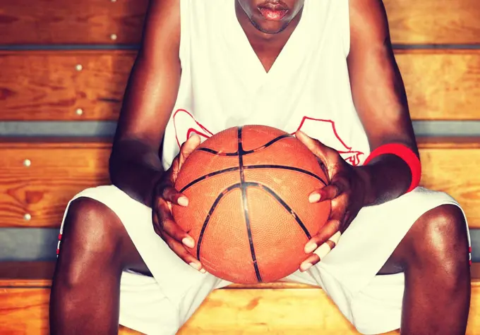 Basketball Player holding basketball