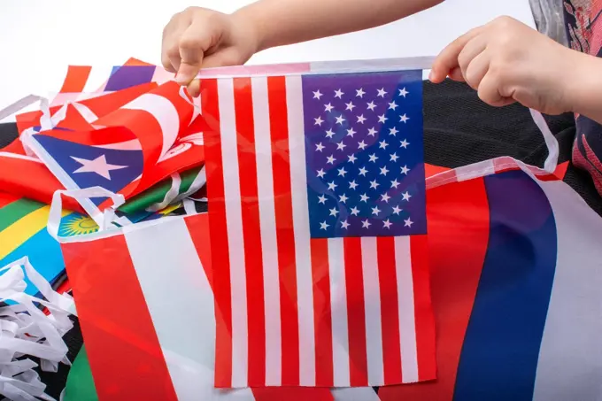 Child hand holding an American flag in hand