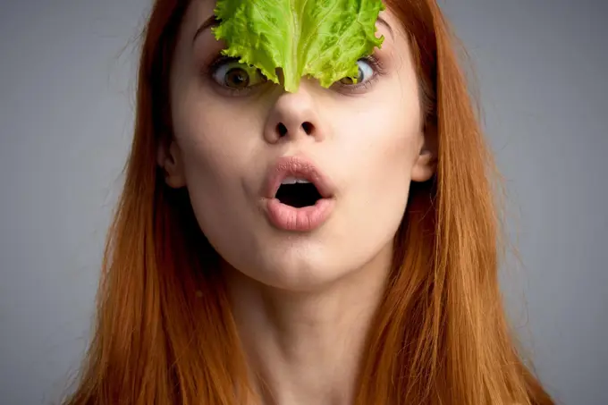 woman with lettuce leaf healthy food diet lifestyle