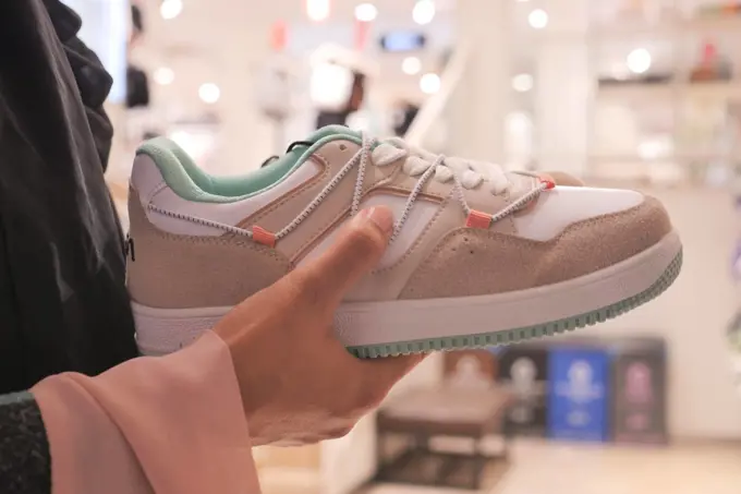 women choosing shoes at local store