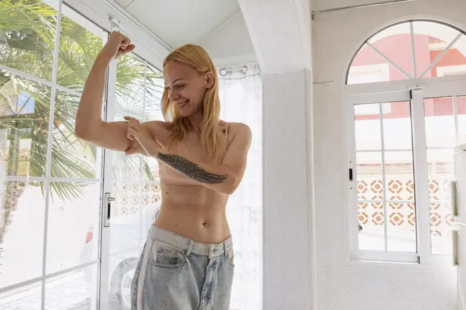 The concept of a successful diet. Cropped shot of a young woman in oversized jeans showing the resul