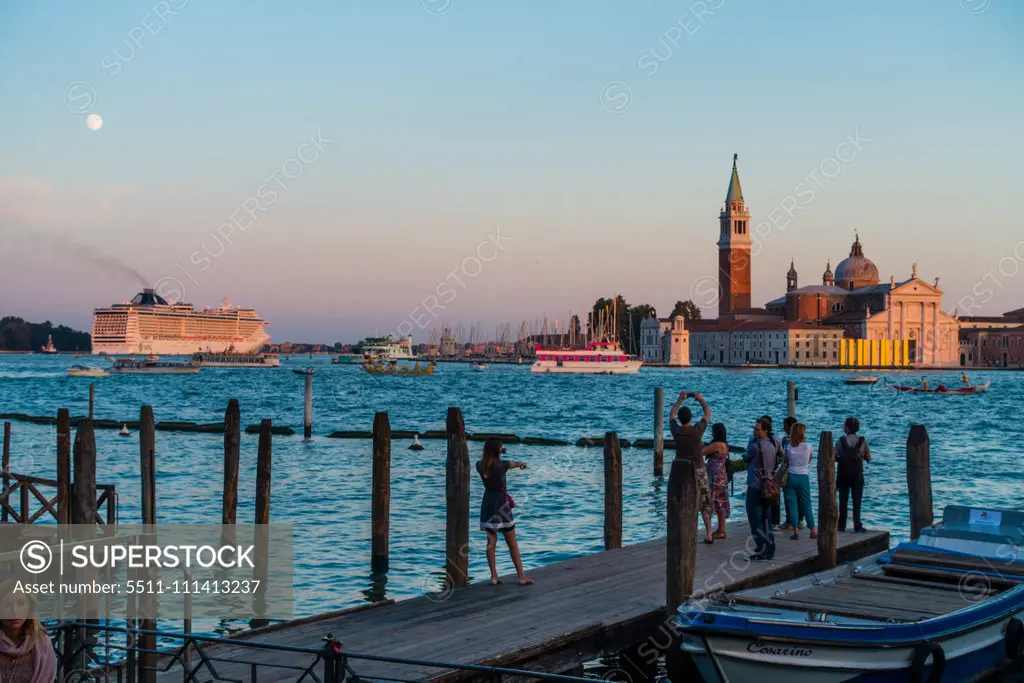 Cruise ship MSC Fantasia, Island of San Giorgio Maggiore in Venice at sun-set, Venice, Venetia, Italy