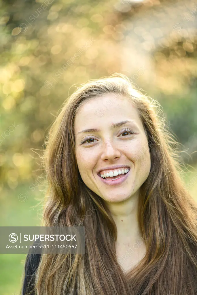 Yound woman in her garden, near Vienna, Austria (model-released)