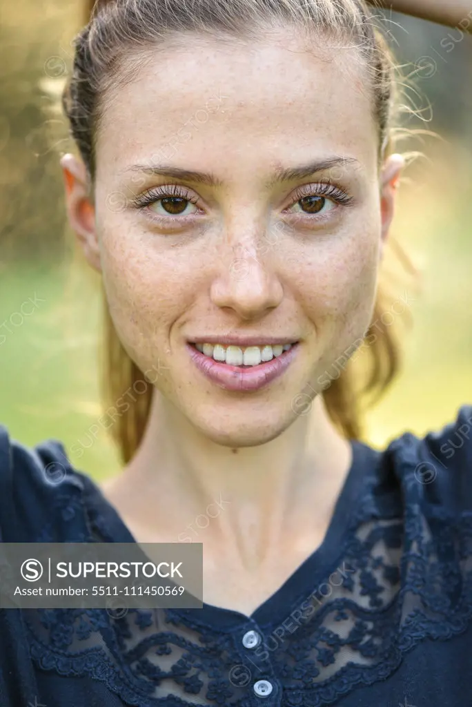 Yound woman in her garden, near Vienna, Austria (model-released)