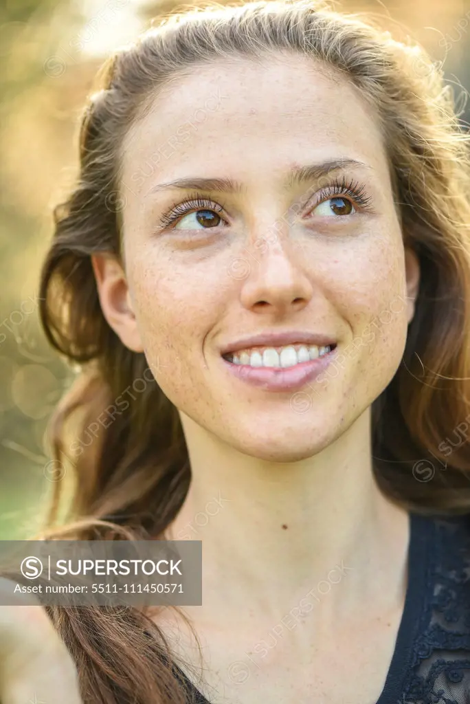 Yound woman in her garden, near Vienna, Austria (model-released)