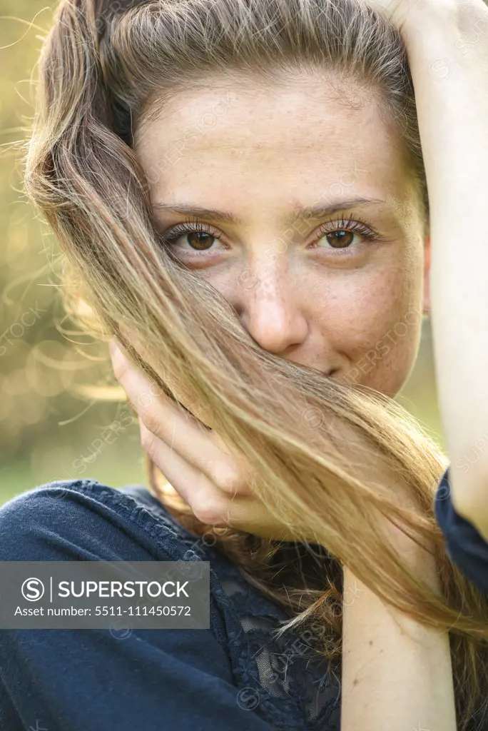 Yound woman in her garden, near Vienna, Austria (model-released)