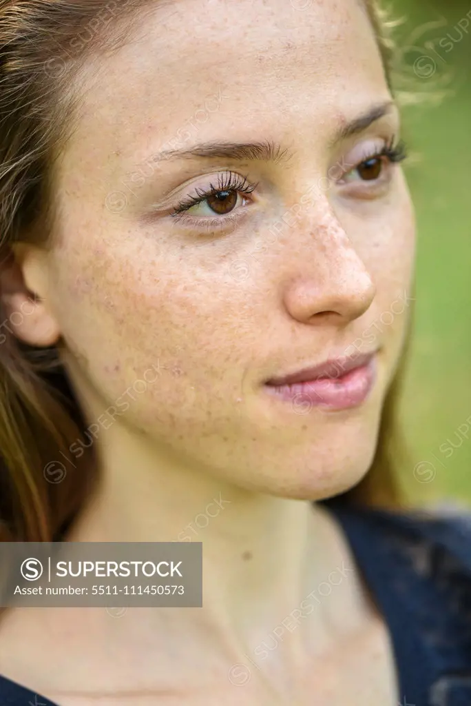 Yound woman in her garden, near Vienna, Austria (model-released)