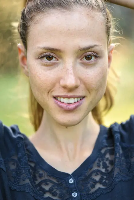 Yound woman in her garden, near Vienna, Austria (model-released)