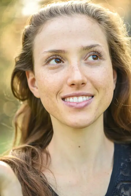 Yound woman in her garden, near Vienna, Austria (model-released)