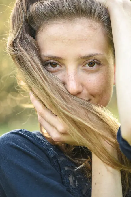 Yound woman in her garden, near Vienna, Austria (model-released)