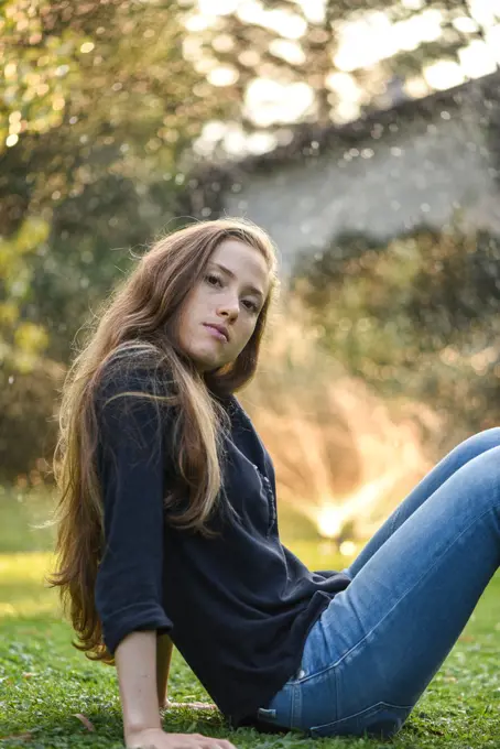 Yound woman in her garden, near Vienna, Austria (model-released)