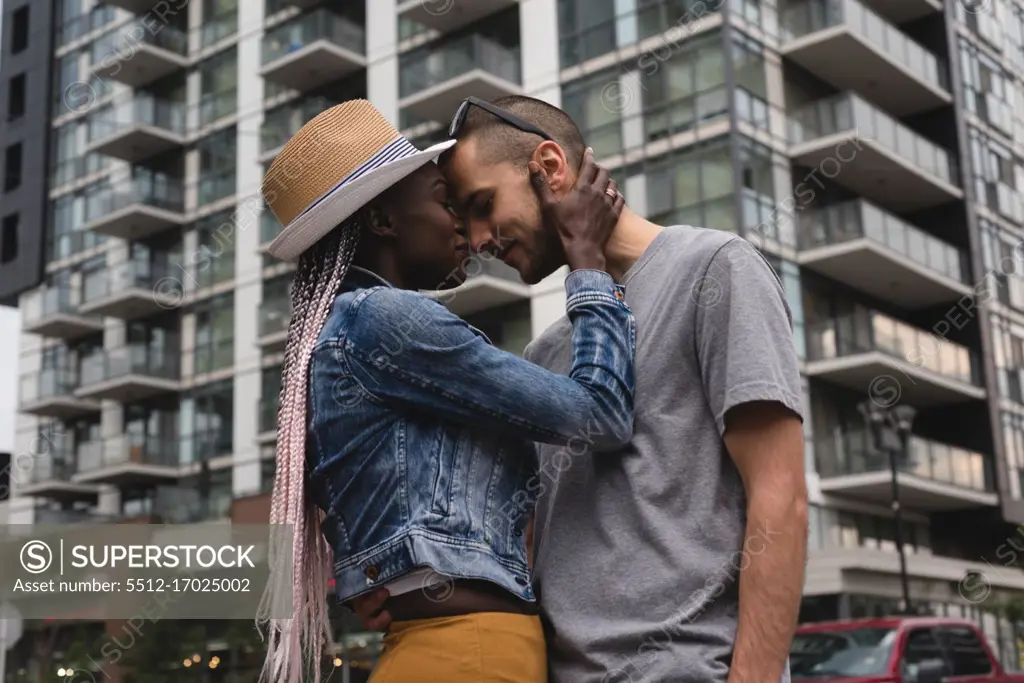 Happy couple embracing in the city