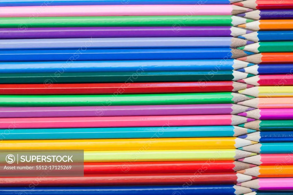 Color pencils interlocking on their own background