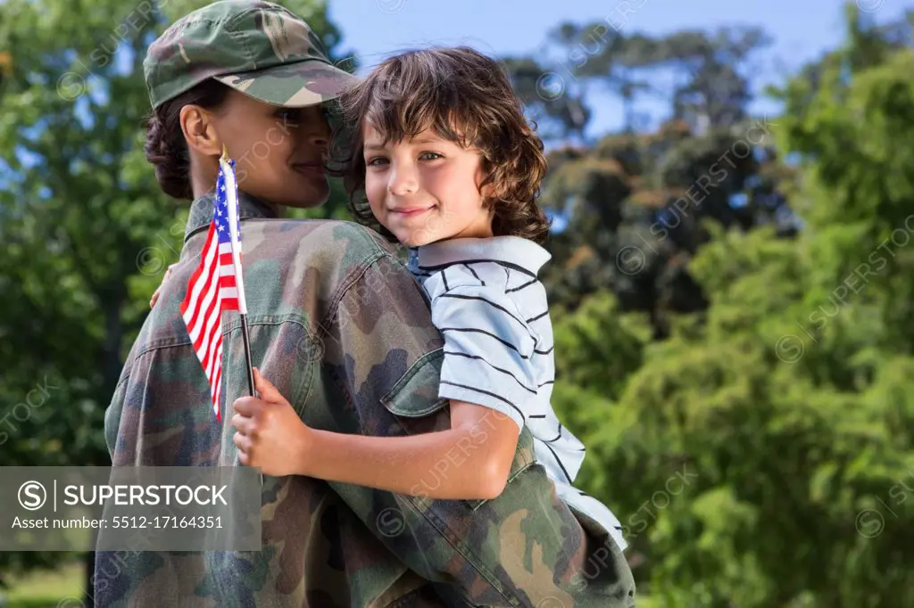 Soldier reunited with her son on a sunny day