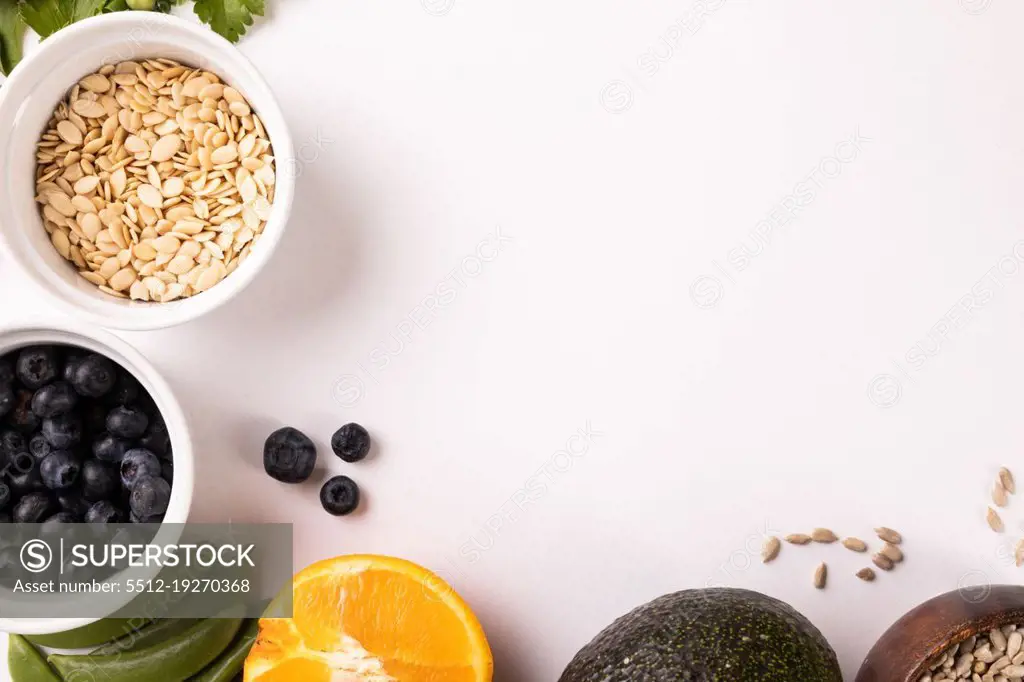 Directly above view of fresh fruits and vegetables by copy space on white background. unaltered, food, healthy eating, organic concept.